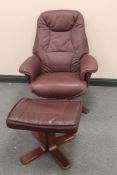 A brown leather relaxer armchair and stool