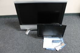 A Sharp 32 inch LCD TV with instructions and remote,