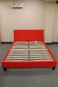 A contemporary red leather 5' bed frame (unassembled,