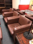 Three contemporary brown leather look armchairs
