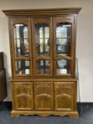 An American style triple door display cabinet