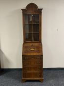 A Regency style domed topped bureau bookcase