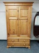 A good quality pine double door wardrobe,