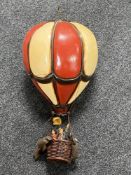 A wooden hanging hot air balloon