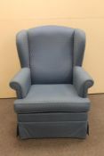 A 20th century wingback armchair in blue fabric