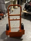 An adjustable twin handled sack barrow with spring axle