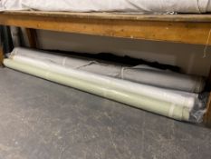 Ten assorted rolls of fabric