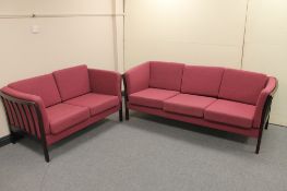 Two Danish wooden framed settees in maroon fabric