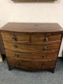 A George III mahogany bowfront chest,
