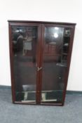 A mahogany double door bookcase