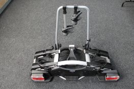 A set of Thule car bike racks with keys