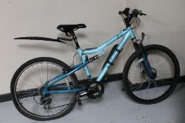 A girl's Apollo full suspension mountain bike
