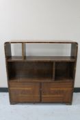 A set of walnut Art Deco bookshelves fitted cupboard beneath