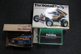 A boxed Tamiya The Hornet remote controlled racking car together with a boxed Futabea control unit