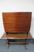 A narrow mahogany drop leaf table and an oak coffee table