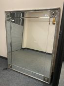 A contemporary bevelled mirror,