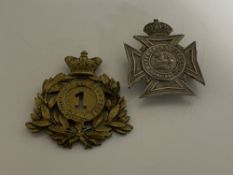 Two Edwardian helmet plates,