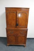 A 20th century walnut cocktail display cabinet