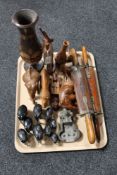 A tray of carved hardwood animal ornaments,