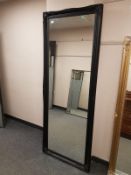 A traditional style black framed mirror,