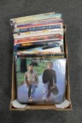 A box of seventy-five vinyl records - Madonna, The Bangles, Elton John,