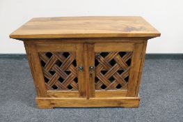 A mango wood double door cabinet