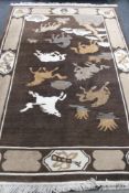 A fringed Chinese embossed rug depicting horses on brown ground