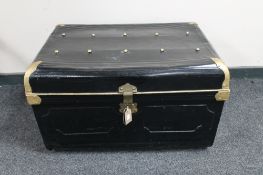 An early 20th century hand painted tin trunk