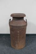 An early 20th century twin handled milk churn