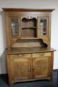An antique continental oak kitchen dresser