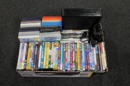 A box of children's DVDs and an Xbox 360 with lead