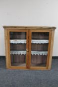 An antique pine double door glazed kitchen cabinet CONDITION REPORT: width 98cm