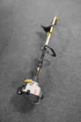 A Ryobi petrol strimmer