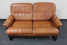 A mid 20th century Danish tan leather two seater settee