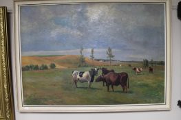 A 20th century gilt framed oil depicting cows by N.