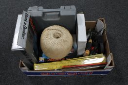 A box of cordless electric drill, Black and Decker air gun, electric saw, rulers,