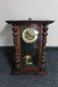 An Edwardian mahogany wall clock with brass and enamelled dial