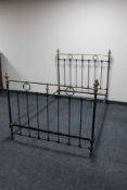 A Victorian cast iron and brass 4' bed frame