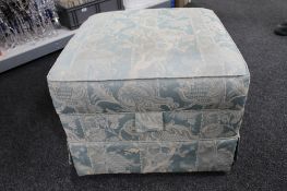 An upholstered storage stool