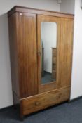 An Edwardian mahogany mirror door wardrobe