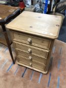 A pine four drawer bedside chest