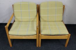 A mid century beech framed Ercol armchair together with one other chair
