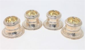 A superb set of four large Georgian silver gilt salts, London marks, Thomas Ross 1820,