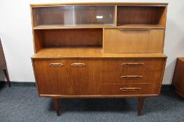 A mid century teak sideboard