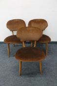 A set of three mid century dining chairs upholstered in brown dralon