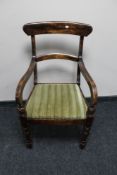 An antique mahogany armchair
