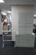 A painted mid century eight drawer chest together with a painted linen chest and antique towel rail