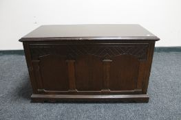 A carved oak blanket box
