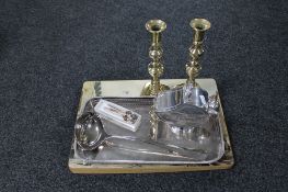 A pair of antique brass candlesticks together with a plated tray of sugar scuttle with scoop,
