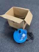 A boxed garment steamer with accessories